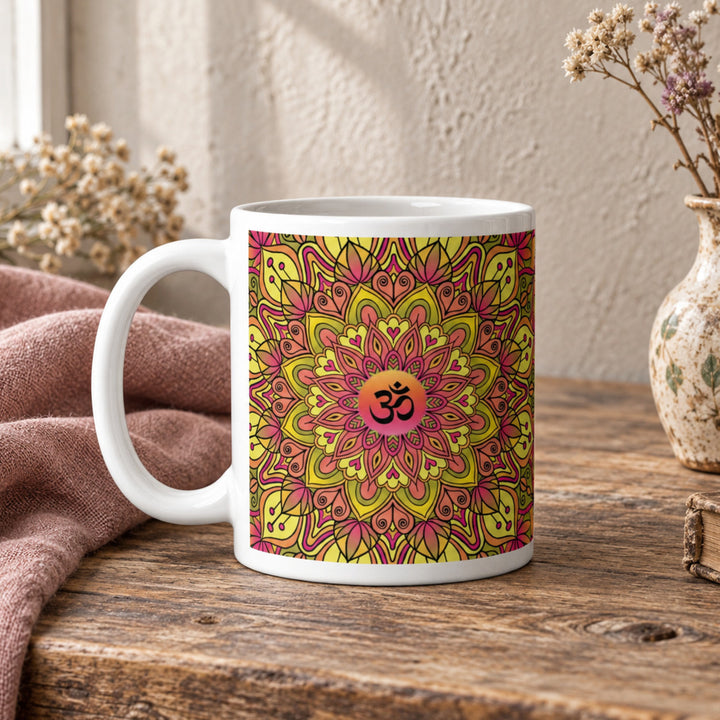 Close-up of Om Mug with Yellow and Pink Mandala Design in a rustic vintage setting