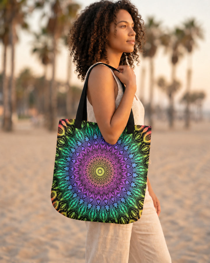 Colorful multicolor mandala tote bag worn by a woman on a beach