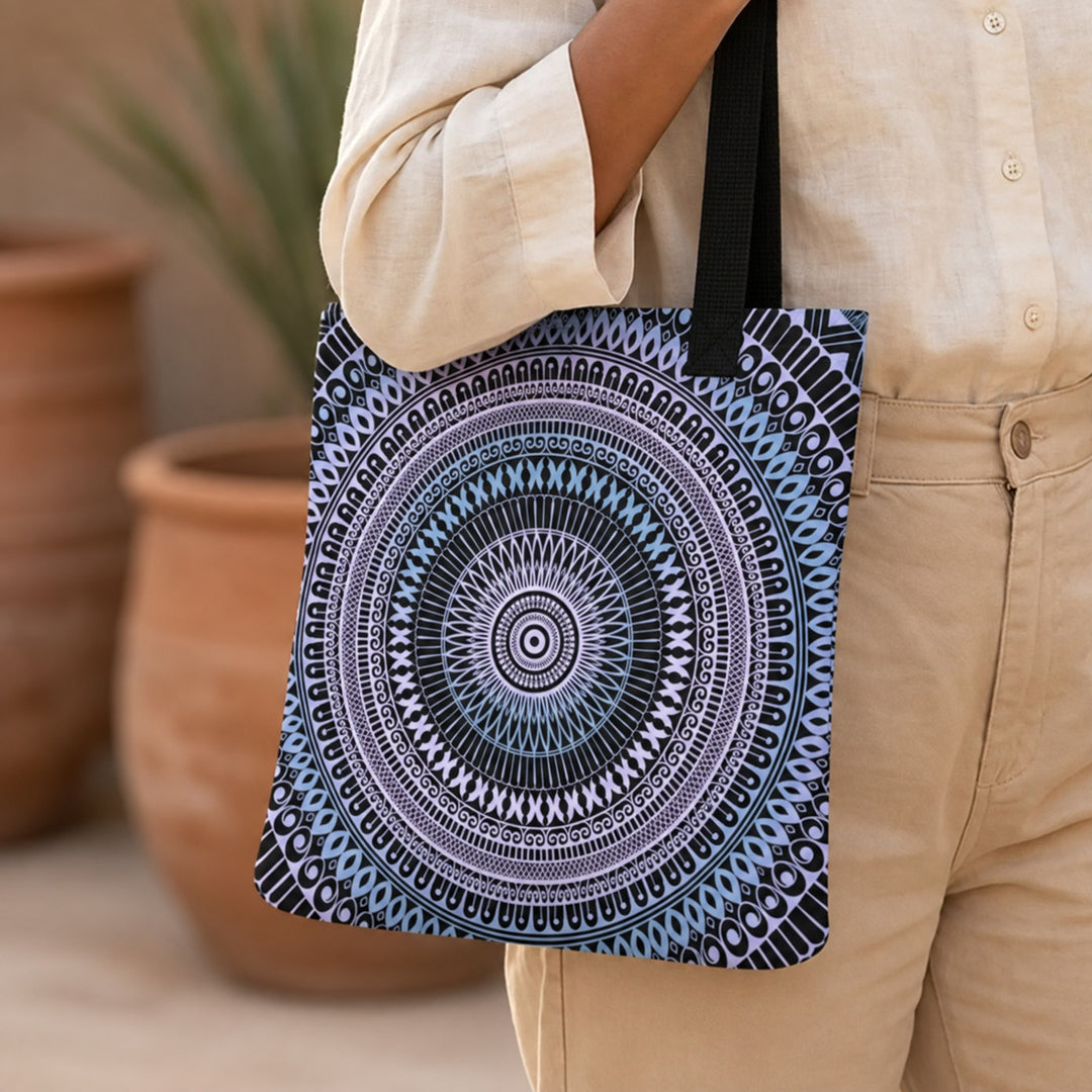 Pastel blue and pink mandala tote bag worn by a woman, close-up