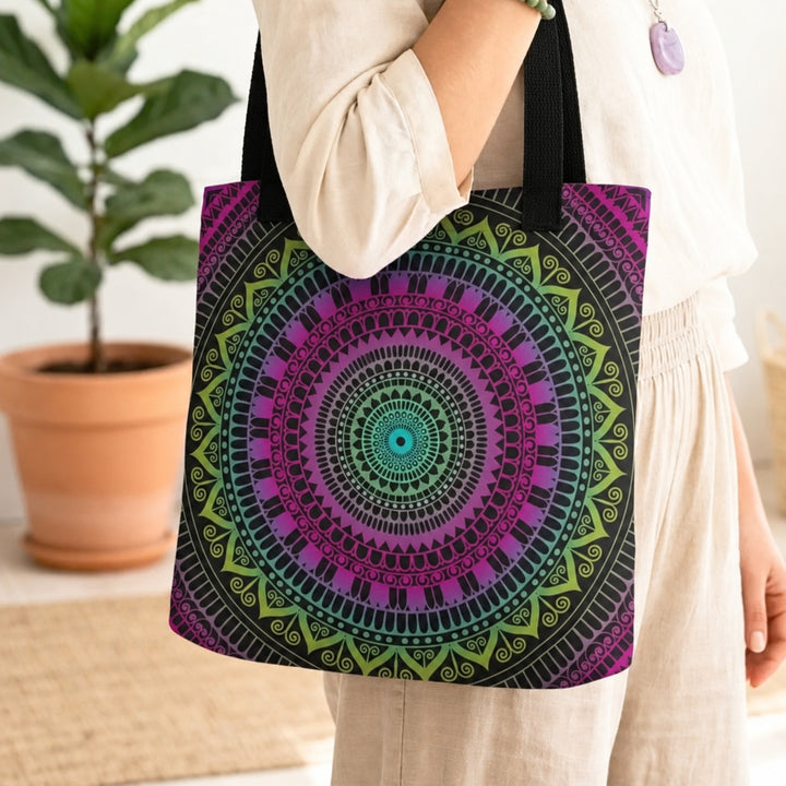 Pink and green tote bag with detailed mandala boho design worn by a model