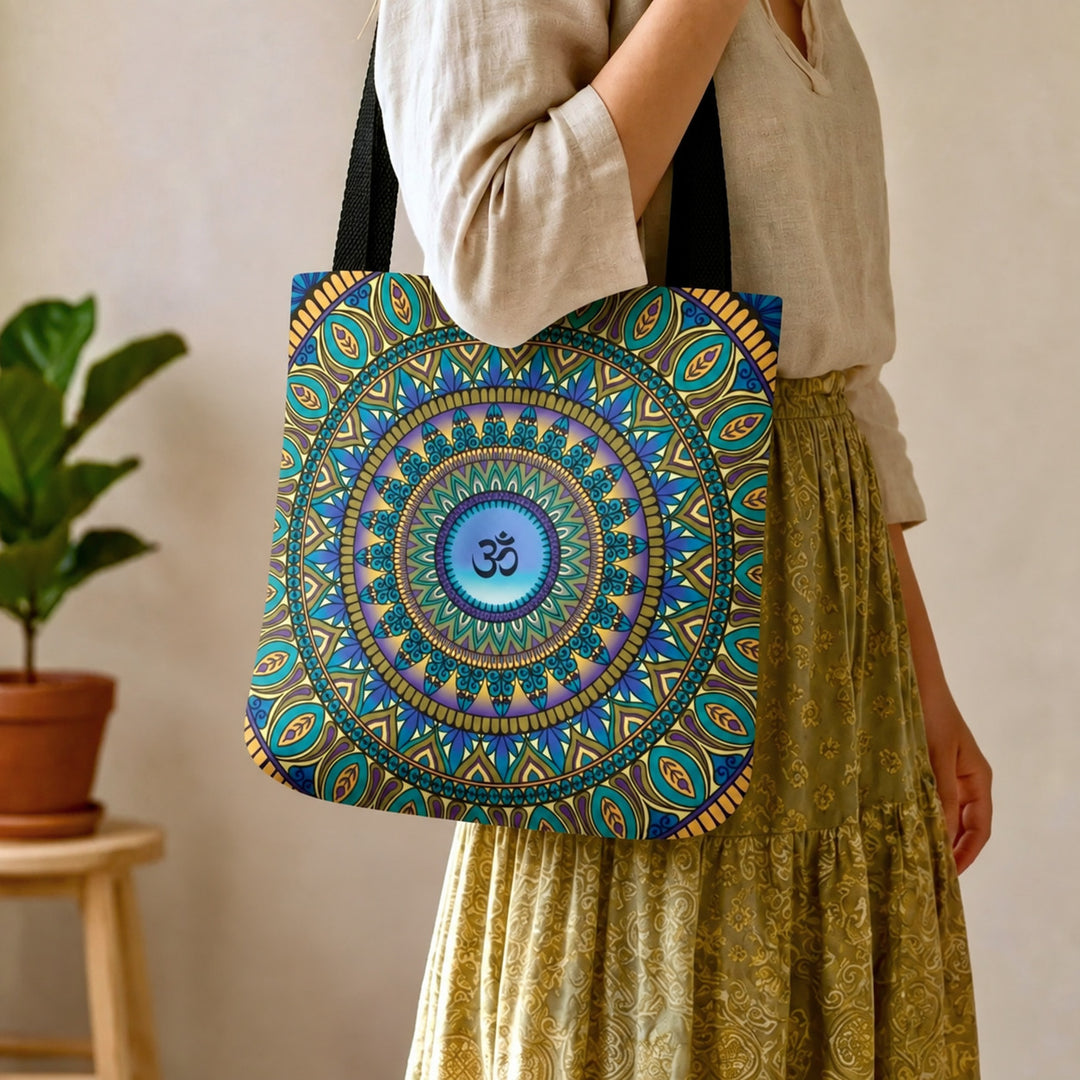 Purple and gold Ohm mandala tote bag worn by a woman, close-up