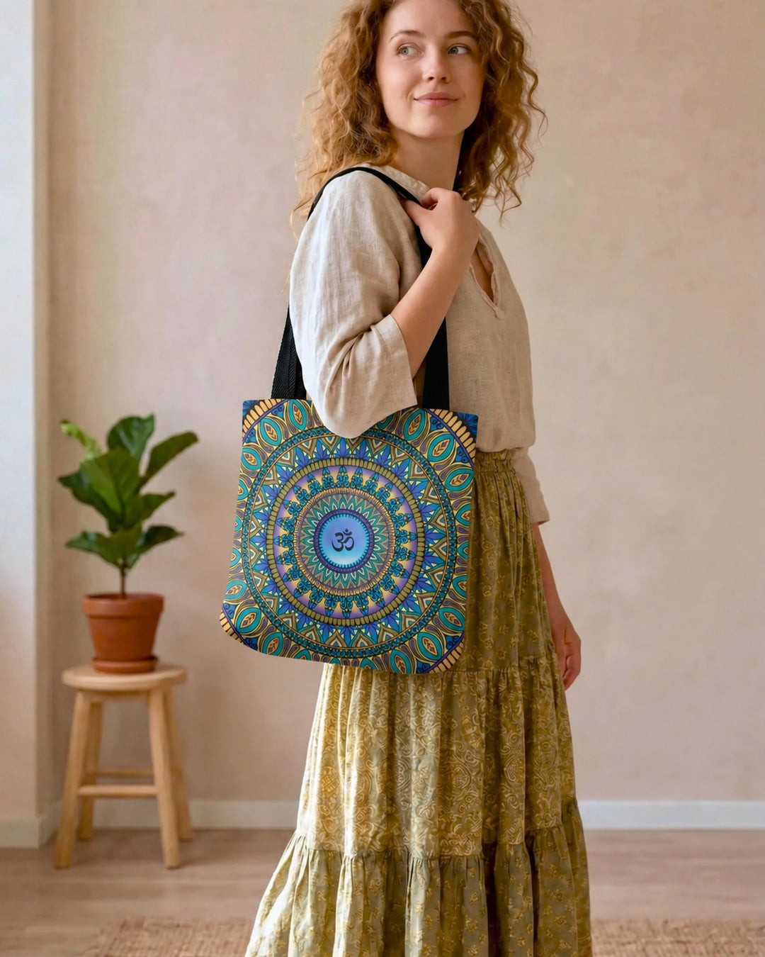 Purple and gold Ohm mandala tote bag worn by a woman in a boho lifestyle setting