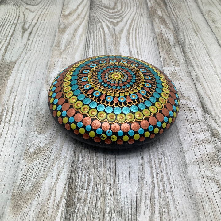 hand painted mandala stone in copper turquoise and yellow