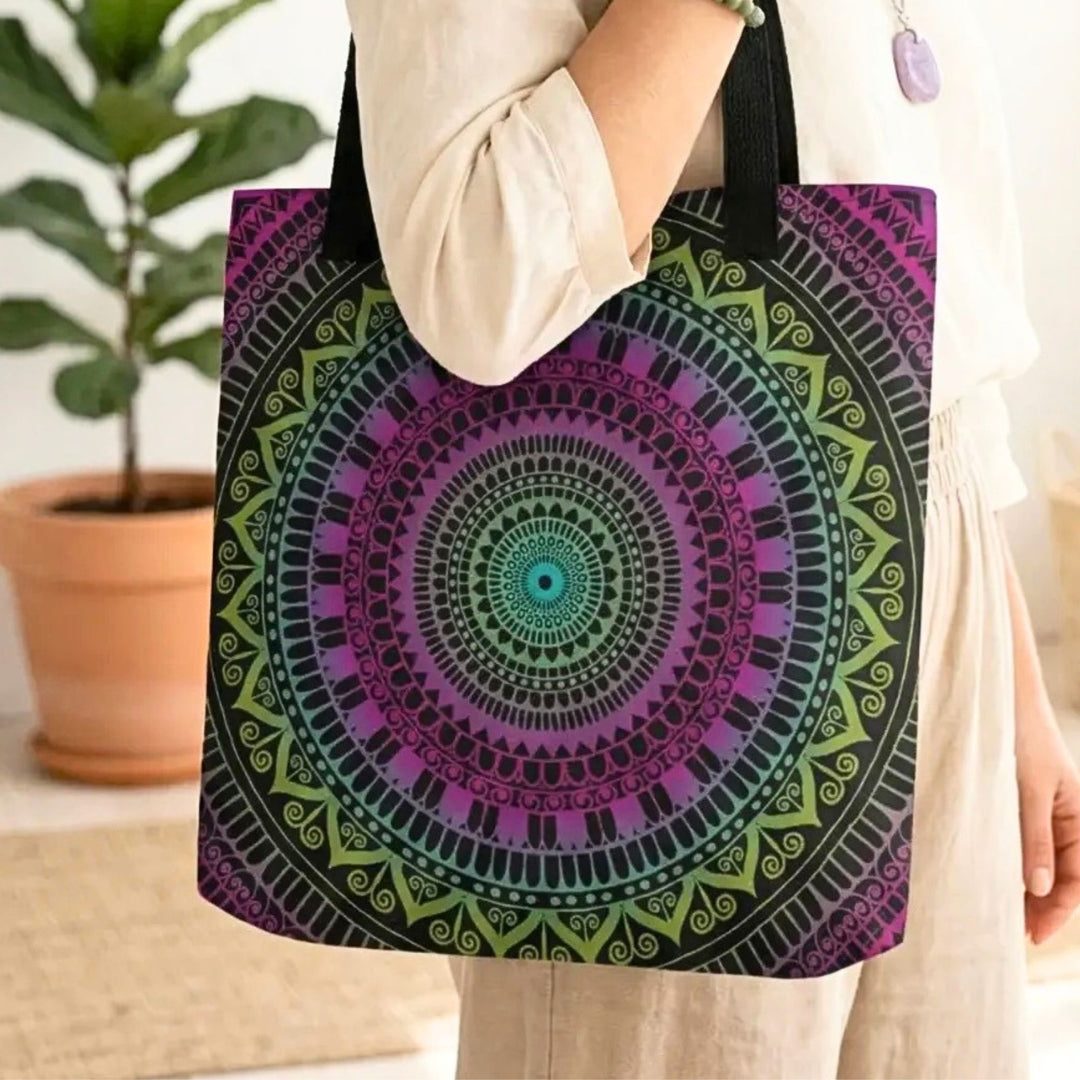 close up of bohemian tote bag with green and purple mandala pattern on black background showing detailed design