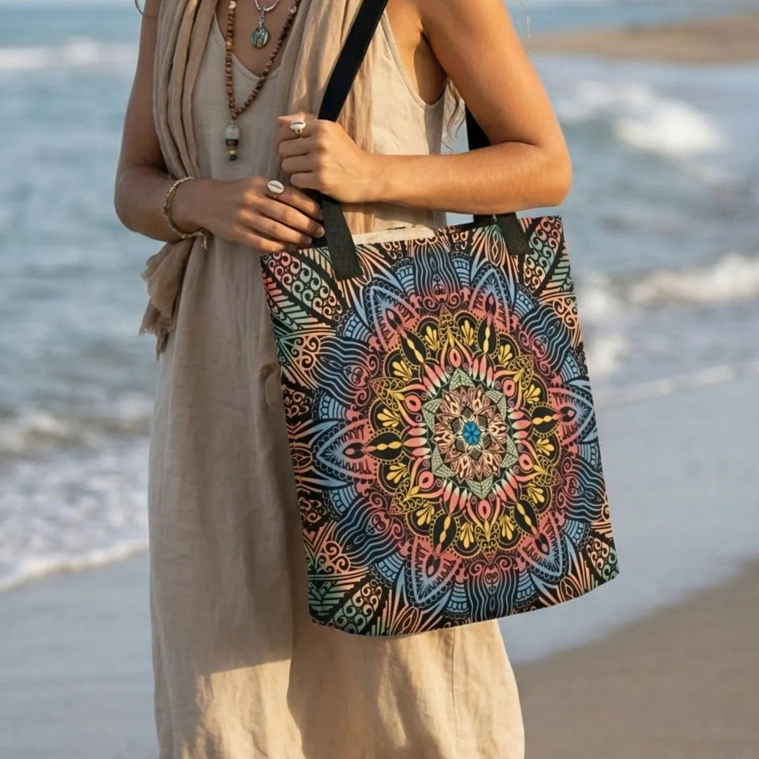 close up of colorful mandala tote bag with intricate pattern on canvas fabric at the beach