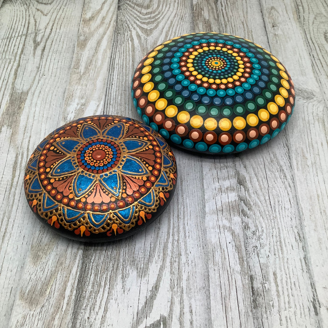 hand painted mandala stone in metallic blue and copper