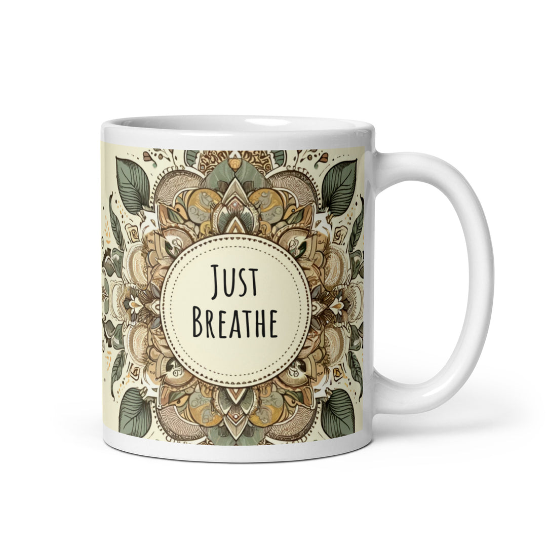 White glossy ceramic mug with a Just Breathe mandala design in beige, sage green, brown and muted gold tones, printed on both sides.