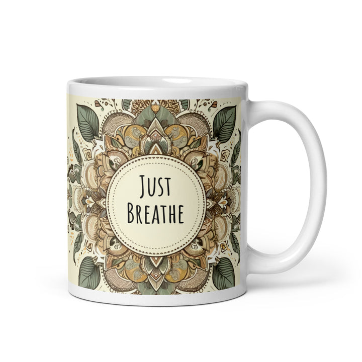 White glossy ceramic mug with a Just Breathe mandala design in beige, sage green, brown and muted gold tones, printed on both sides.