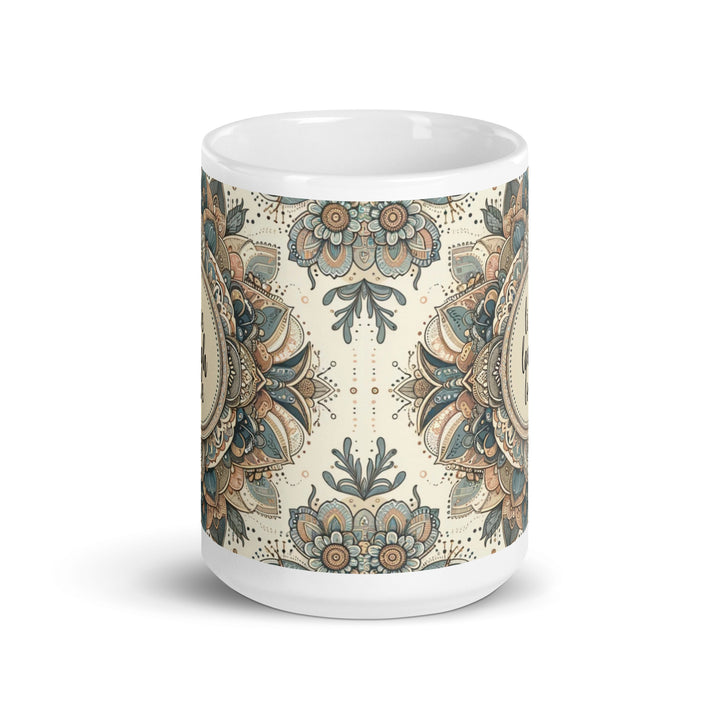 White ceramic mug with a detailed blue and beige mandala design and the phrase 'Live Laugh Love' in the center.