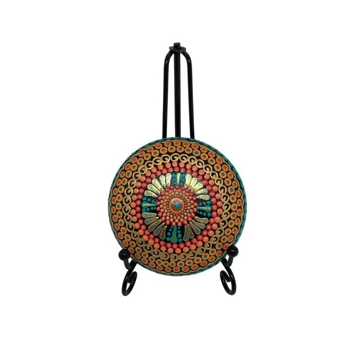 hand painted mandala stone in orange green and gold