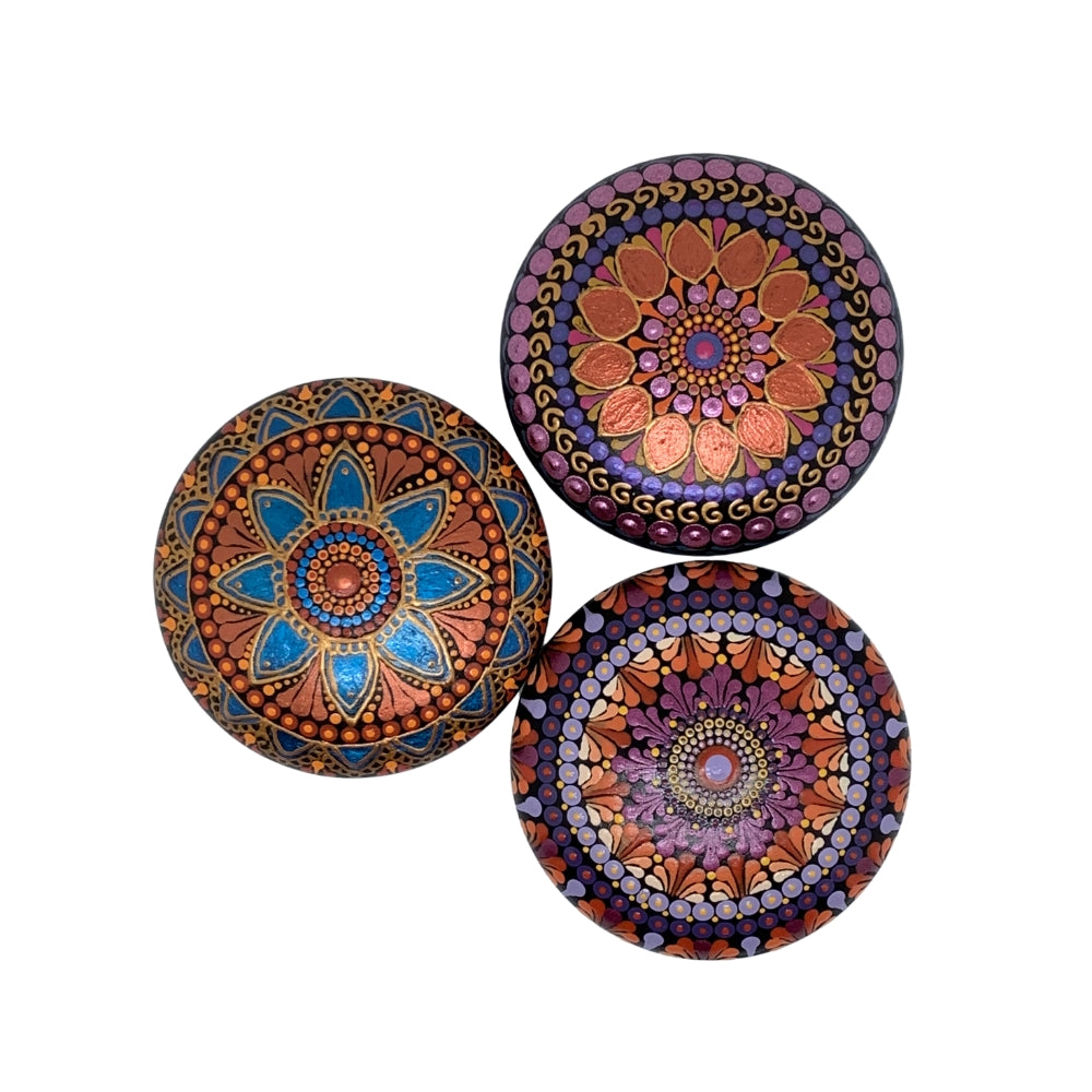 hand painted mandala stone in metallic blue and copper
